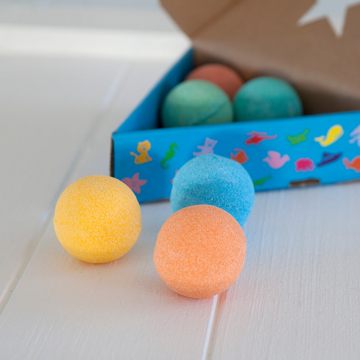 6 pack kids bath bombs open box showing colours