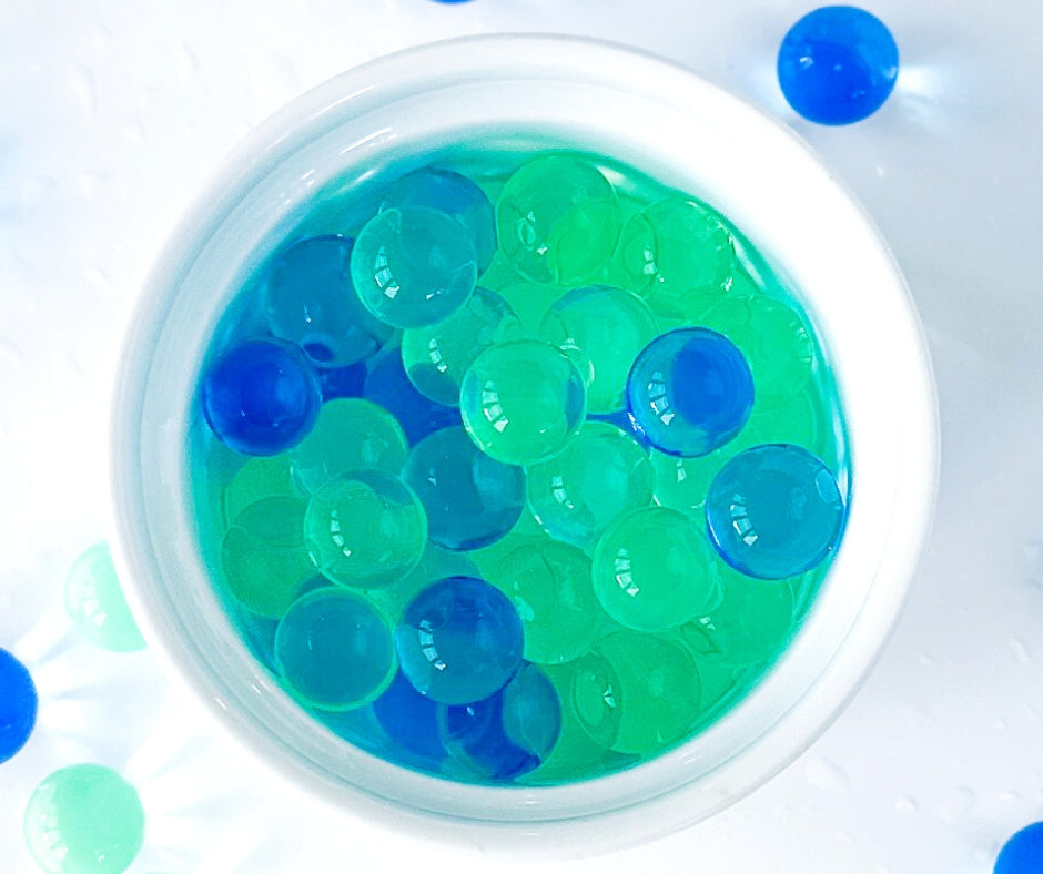 Bowl of Jungle Gems water beads for dinosaur play