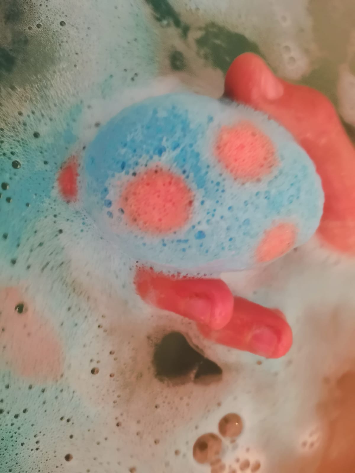 Blue Egg Bath Bomb Sprudel fizzing with a sponge toy coming out