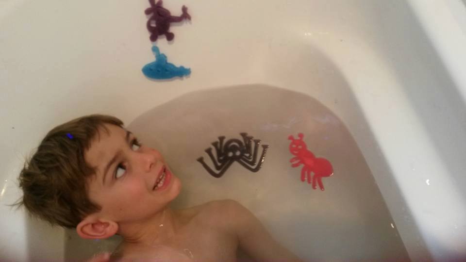 Boy in the bath with Bugs Bath Beans sponge toys