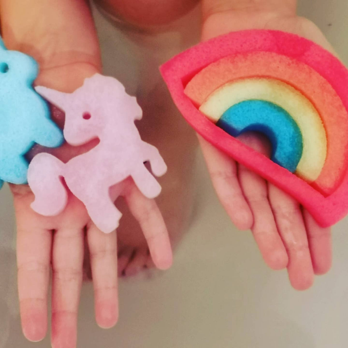 Full set of Unicorn Rainbow Bath Beans sponge toys in the bath